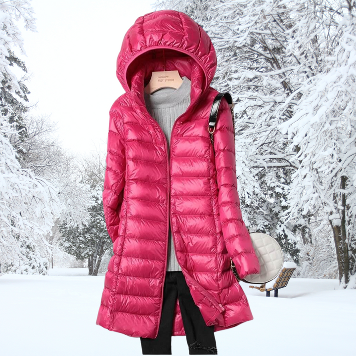 Detail of the comfortable hooded design on a women's ultra-light insulated jacket, providing extra warmth.