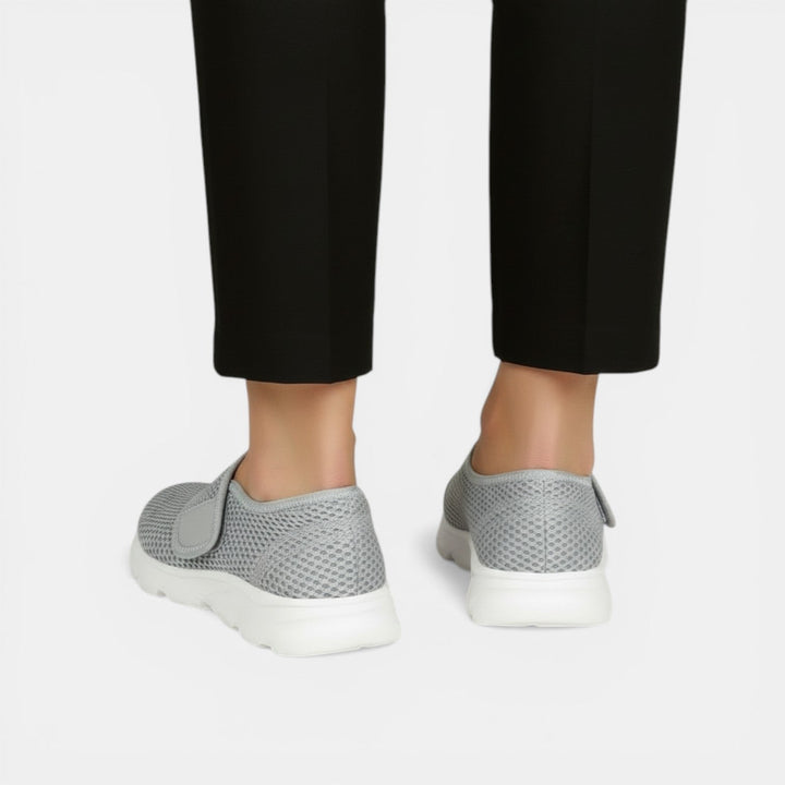 Lightweight women's sneakers with orthopedic support, ideal for walking, active wear & foot comfort.