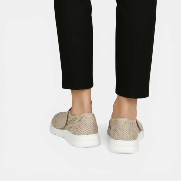 Active women's lightweight walking shoes, featuring breathable material & orthopedic support for daily comfort.