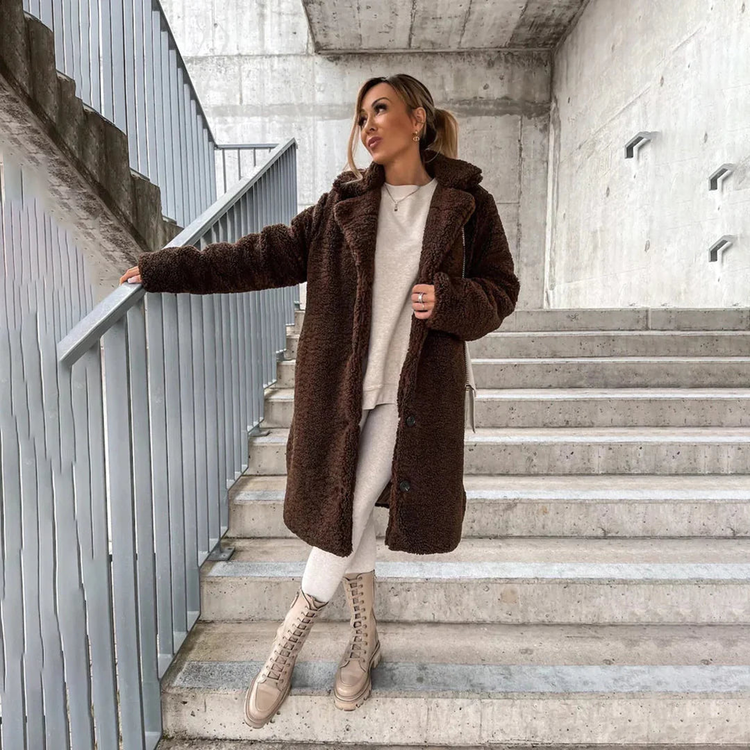 Cozy women's longline teddy coat in ultra-soft plush fabric, perfect for fall and winter style.