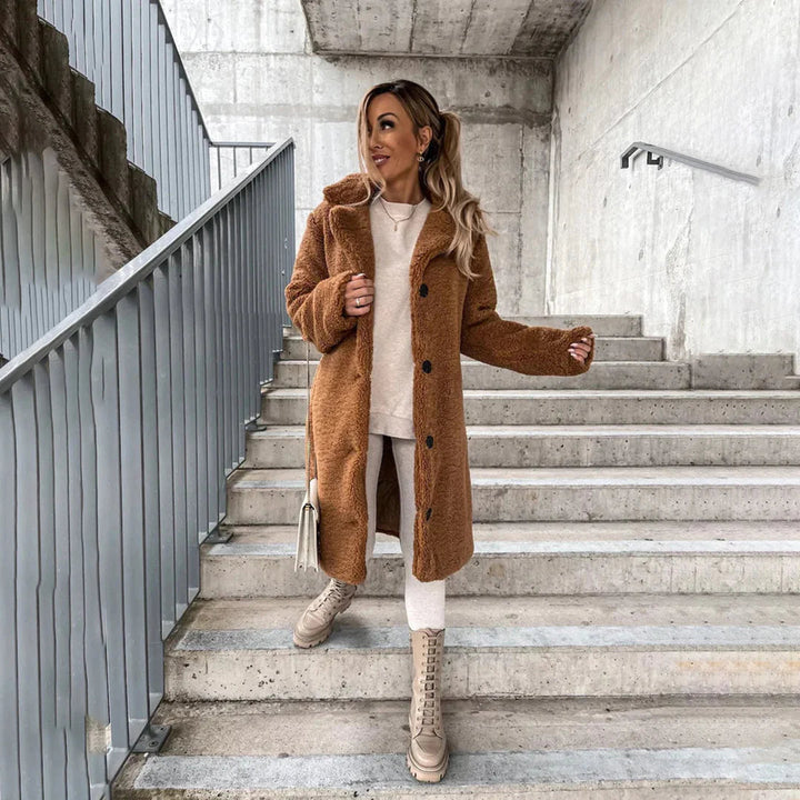 Chic women's ultra-soft teddy longline coat, warm plush outerwear for winter and fall fashion.