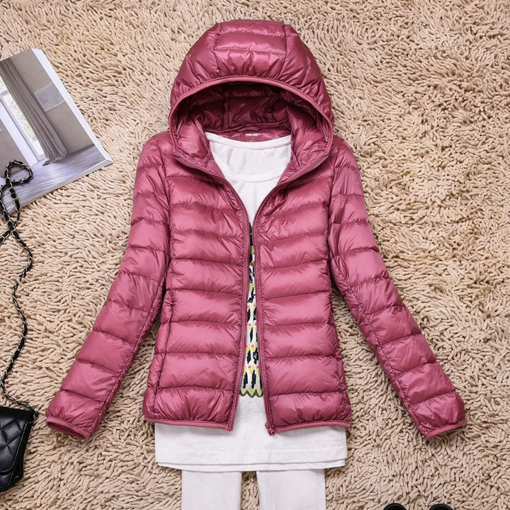 Fall fashion women's jacket, insulated & hooded, perfect for crisp mornings and evenings.