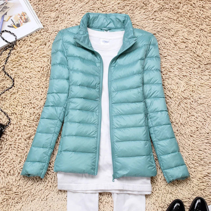 Cozy women's winter jacket, ultralight insulation, hooded for ultimate warmth and comfort.