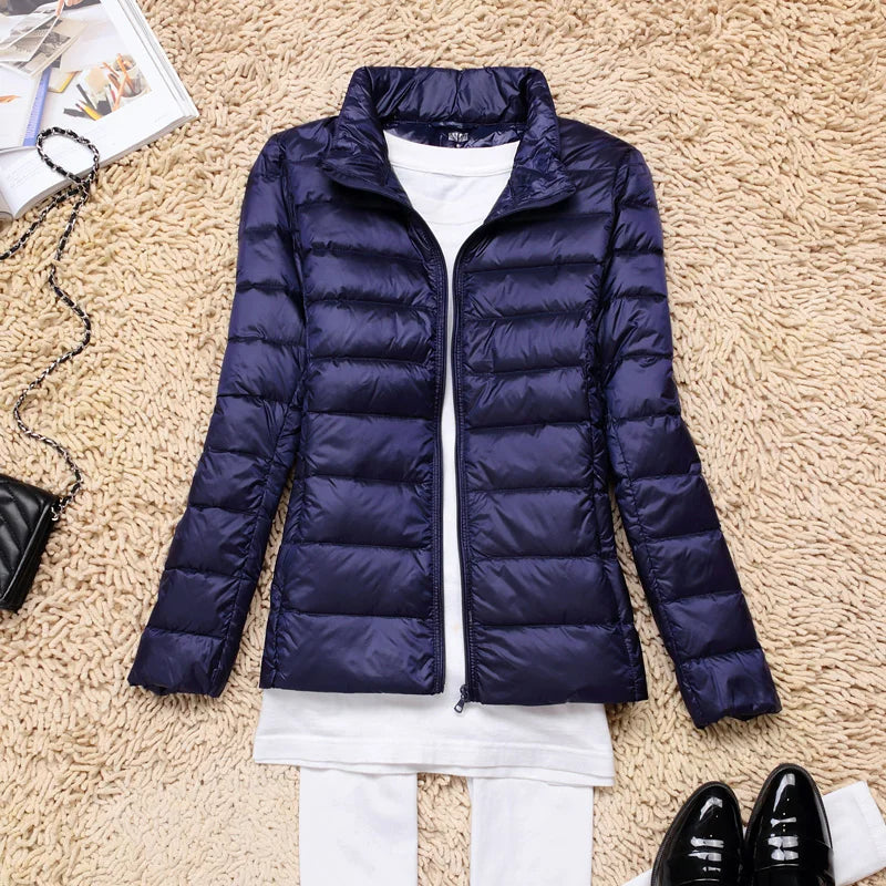 Women's everyday hooded jacket, offering lightweight warmth for various activities and seasons.