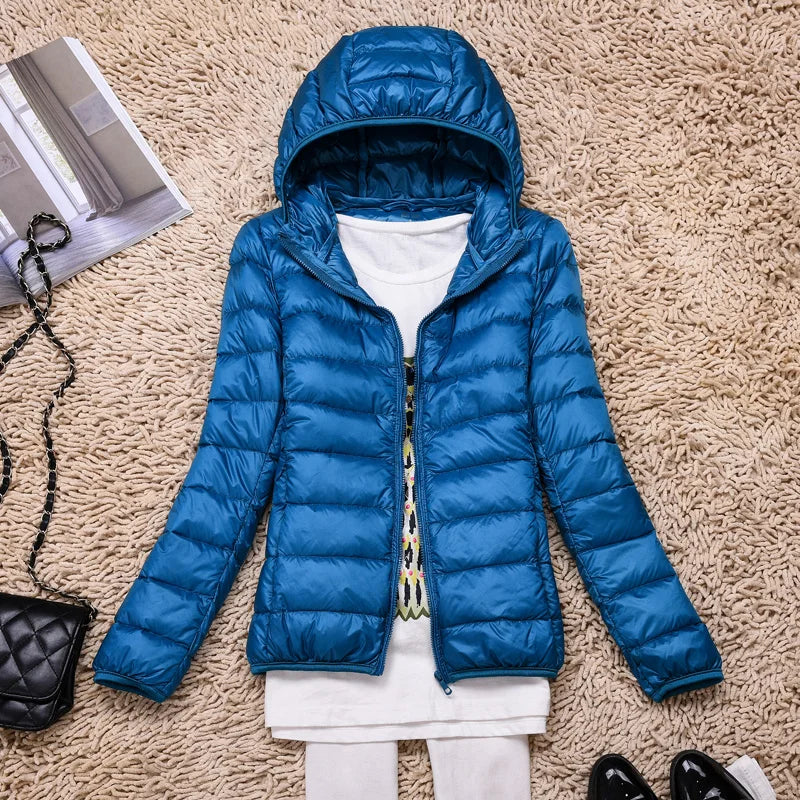 Comfortable women's insulated jacket, hooded for extra warmth, perfect for everyday style.