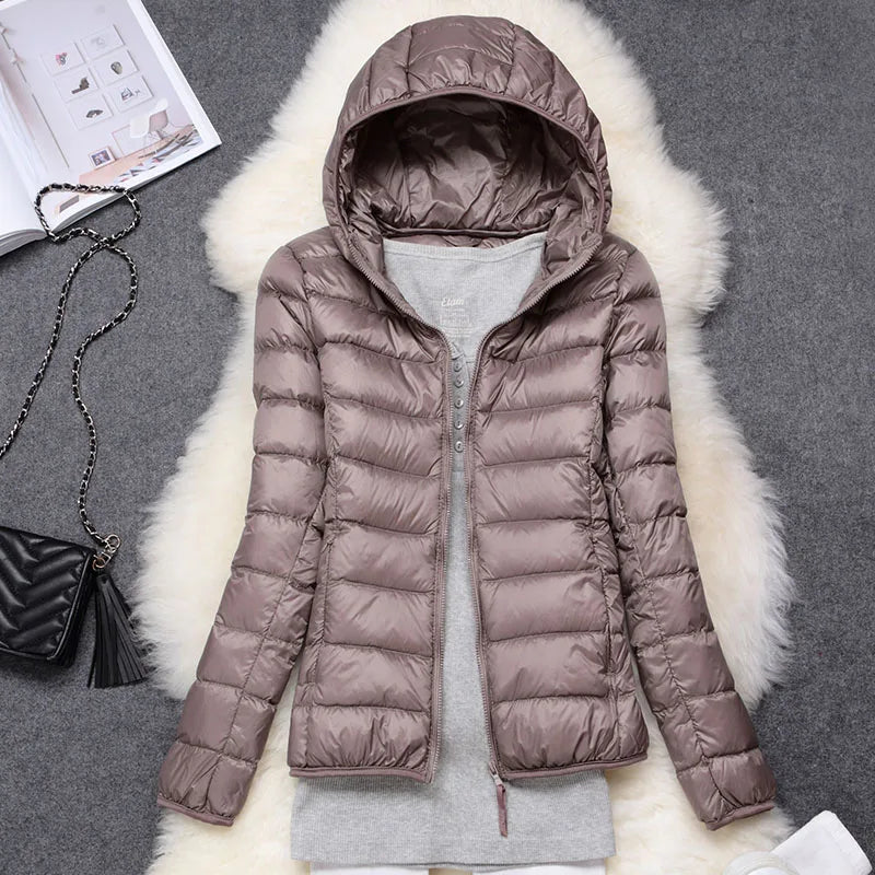 Women's ultralight fall jacket, hooded and insulated, ideal for daily wear and active living.