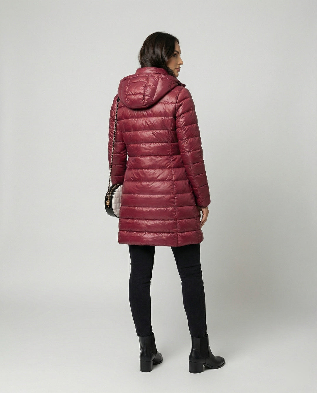 Insulated women's outerwear, hooded and ultralight, great for layering in any season.