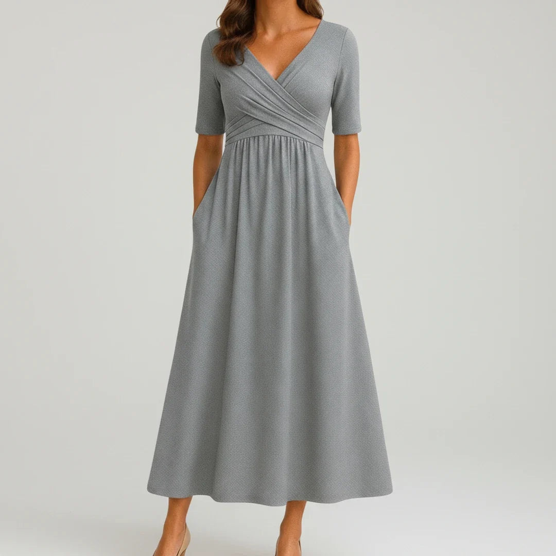 Women's V-neck A-line midi dress with pockets, perfect for casual summer style. Effortless and comfortable.