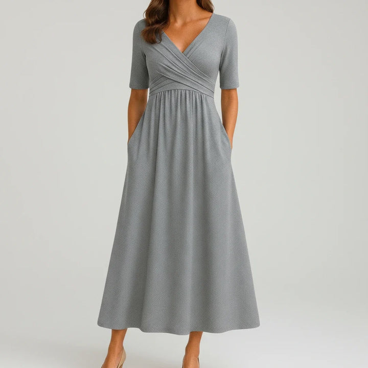 Women's V-neck A-line midi dress with pockets, perfect for casual summer style. Effortless and comfortable.