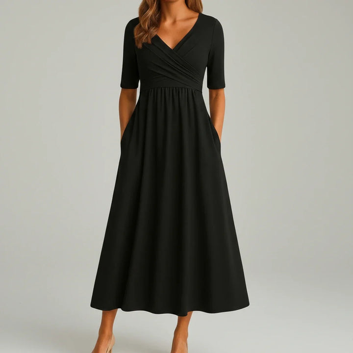 Elegant V-neck women's midi dress featuring a flattering A-line silhouette and practical side pockets.