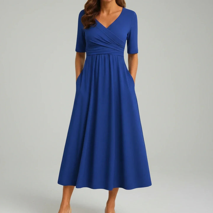 Casual summer V-neck midi dress for women. This A-line flare dress offers comfort, style, and pockets.