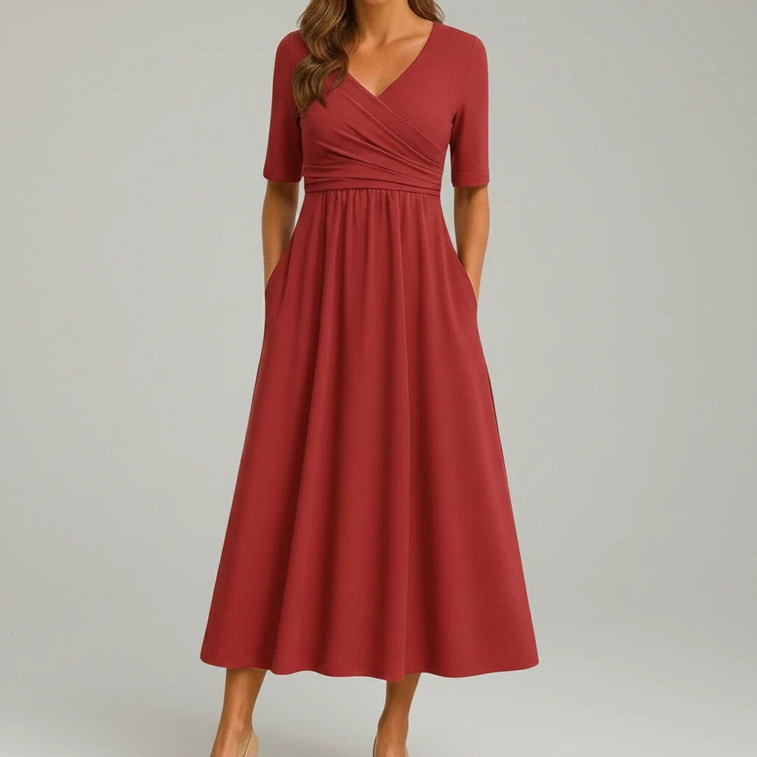 Chic women's V-neck A-line midi dress, sleeveless design with a flowing flare and practical pockets. Elegant fashion.