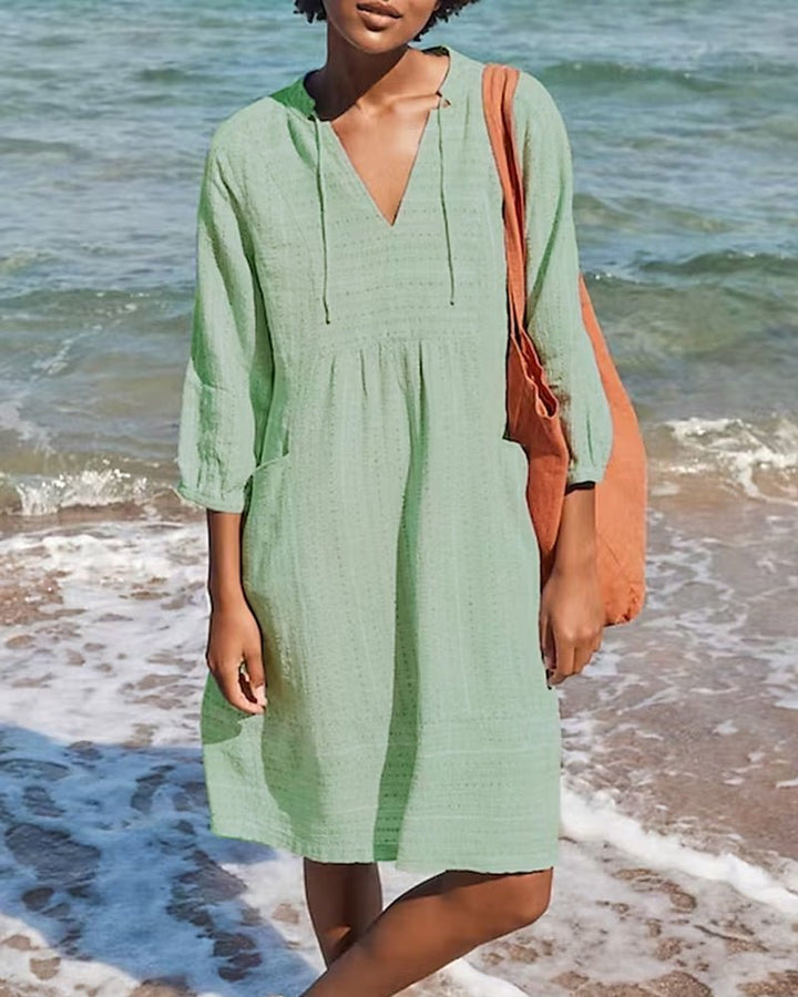 Elegant V-neck bohemian midi dress for women, featuring a relaxed, flowing silhouette perfect for summer comfort.