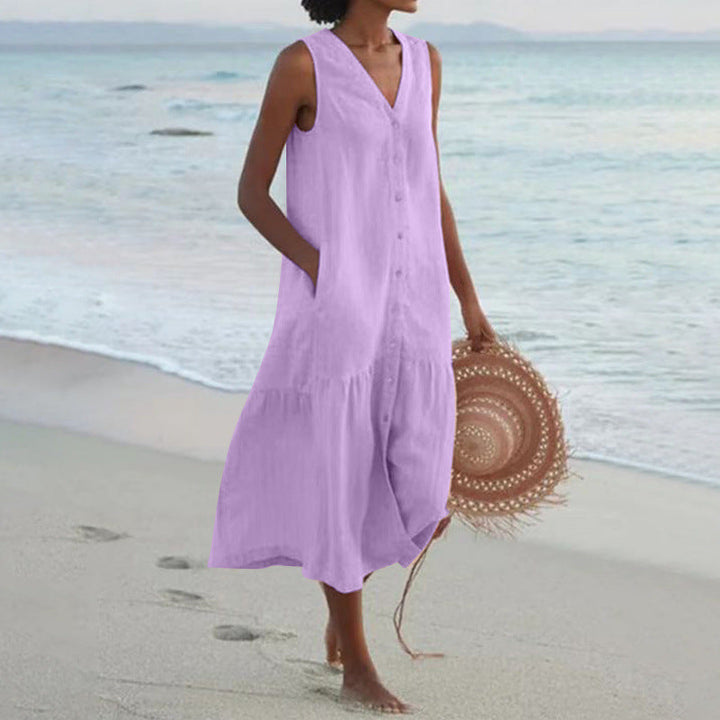 Flowy women's midi dress with V-neck, button front, and tiered hem. Great for summer vacation outfits.