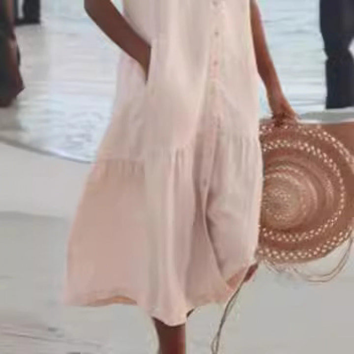 Vacation-ready women's V-neck sleeveless dress with a trendy button front and flowy tiered hem.