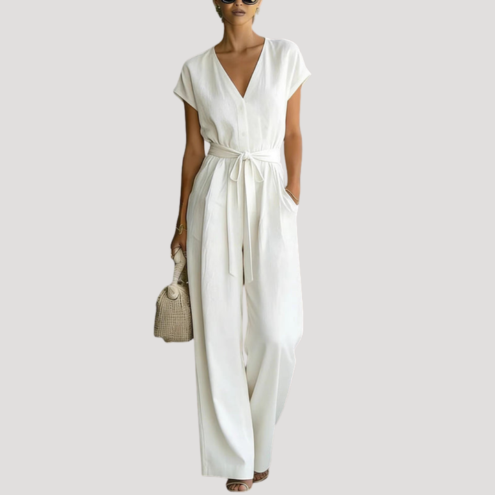 Women's V-neck cap sleeve wide leg jumpsuit with tie waist, perfect for casual summer elegance.