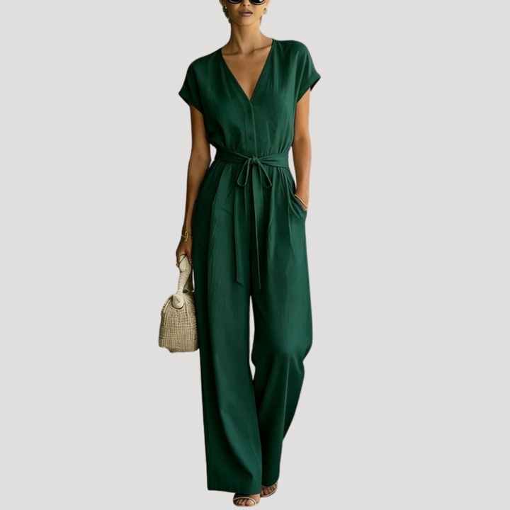 Stylish women's wide leg jumpsuit with a flattering V-neck, cap sleeves, and adjustable tie waist.