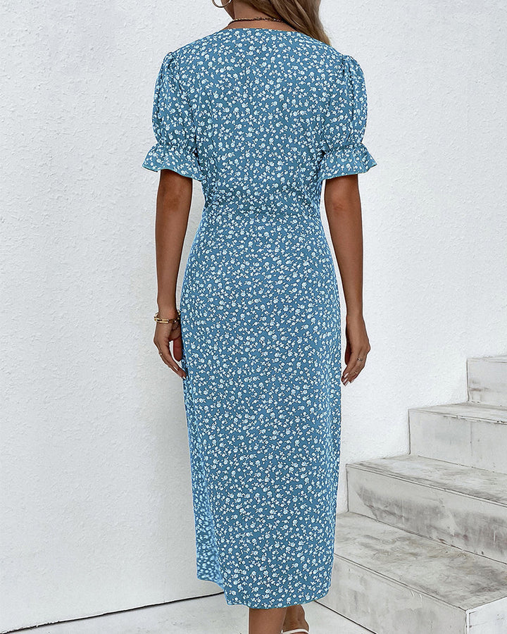 Breezy floral print v-neck summer dress, designed with a flowy midi length for ultimate comfort and style.