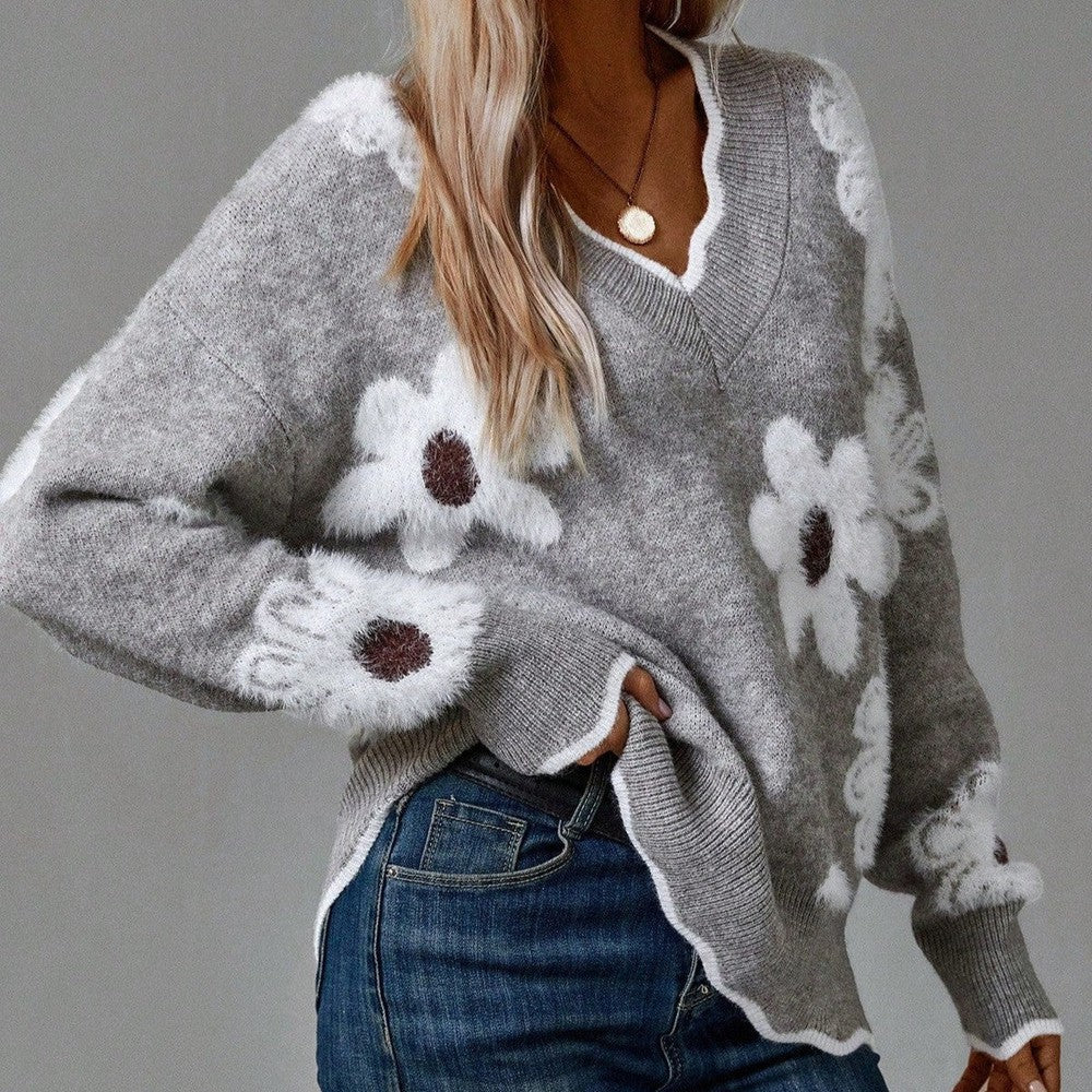 Women's V-neck floral sweater with textured appliqués. Cozy long sleeve jumper for stylish casual wear.