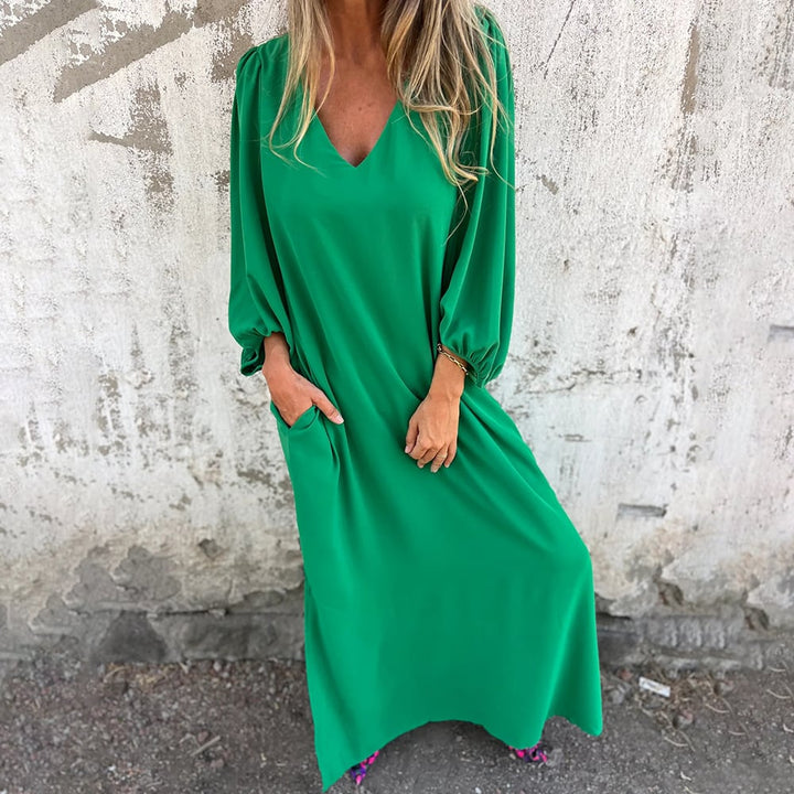 Relaxed women's V-neck maxi dress with loose balloon sleeves & convenient pockets. A comfortable and elegant long summer dress.