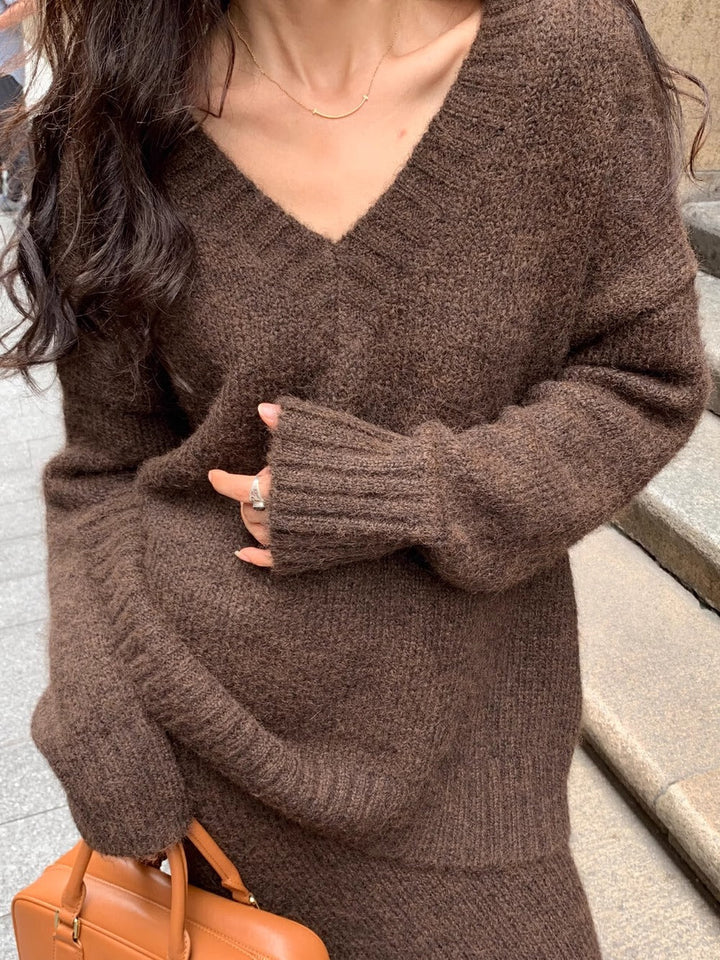 Stylish women's V-neck long sleeve sweater, part of a comfortable fall and winter midi skirt set.