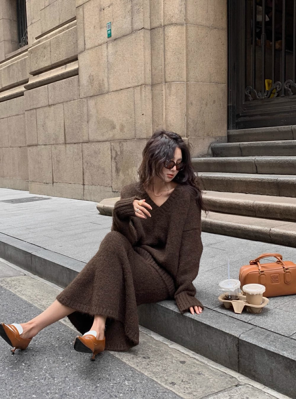 Comfortable women's long sleeve V-neck sweater & midi skirt set, perfect for casual fall and winter wear.