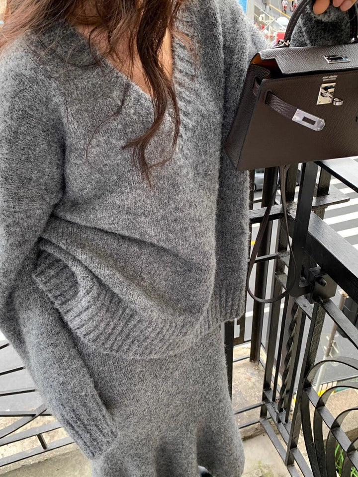 Chic women's two-piece V-neck sweater & midi skirt brunch outfit, perfect for a stylish coordinated look.