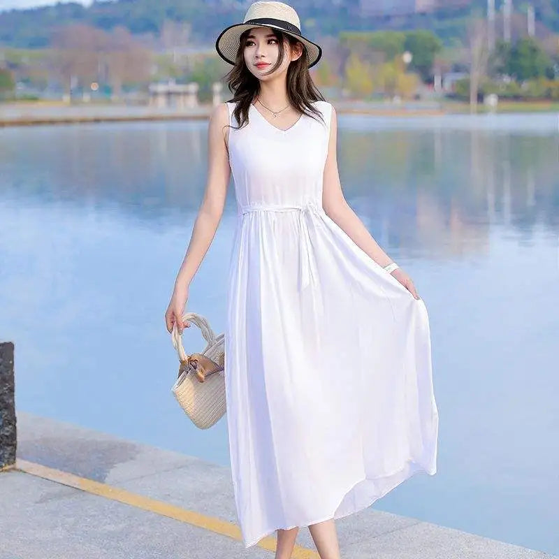 Elegant sleeveless V-neck maxi dress with tie waist & pockets, suitable for versatile summer events.
