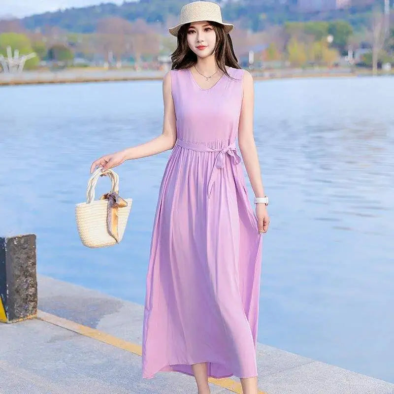 Women's beach V-neck maxi dress with tie waist & pockets, ideal for a comfortable & stylish summer day.