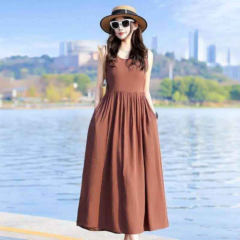 Comfortable women's V-neck maxi dress with tie waist, pockets. Versatile for summer or beach wear.