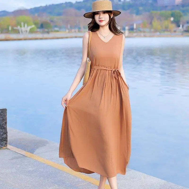 Elegant V-neck maxi dress for women, highlighting the chic tie waist and convenient side pockets.