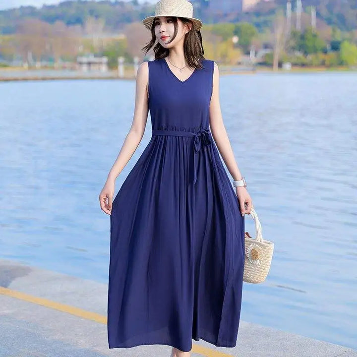 Versatile women's V-neck maxi dress, ideal for beach or casual summer fashion. Features tie waist & pockets.