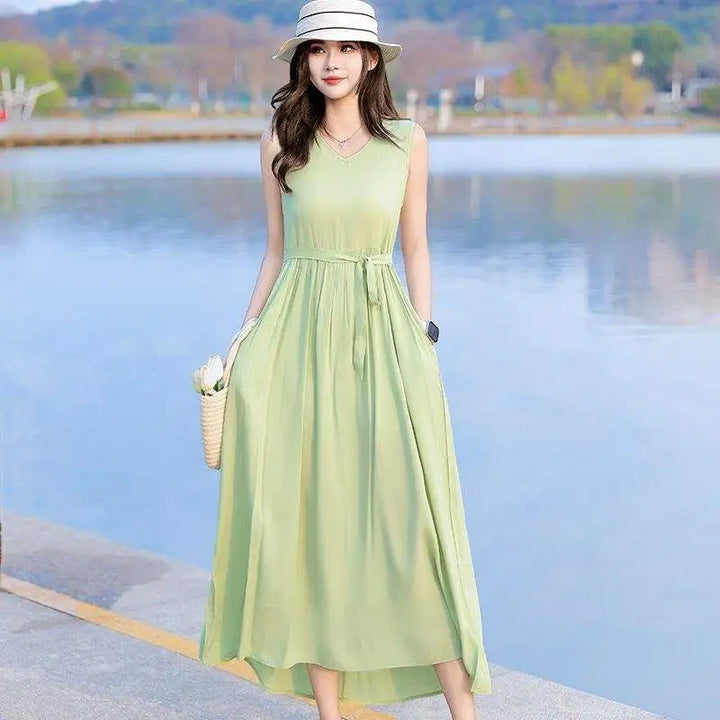 Women's sleeveless V-neck maxi dress with convenient pockets & a flattering tie waist. Great for summer.