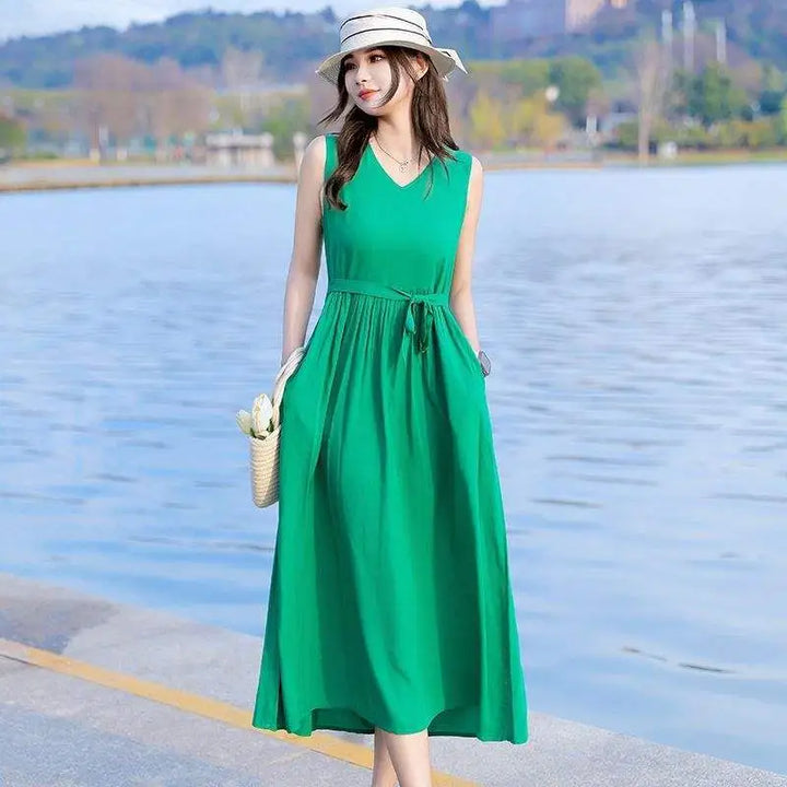 Plus size women's V-neck maxi dress with tie waist & pockets, comfortable & stylish for summer fashion.