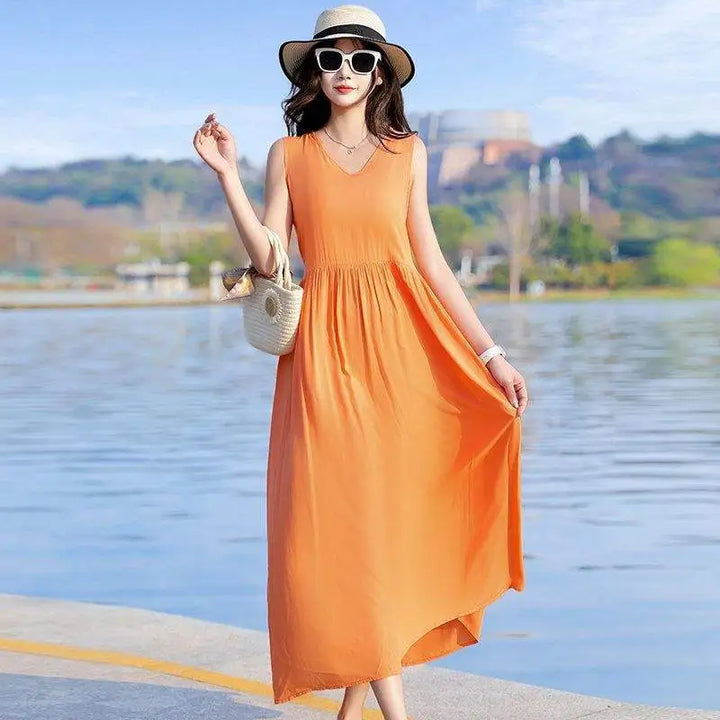 Navy V-neck maxi dress for women, sleeveless, with tie waist & pockets. Perfect for elegant summer style.
