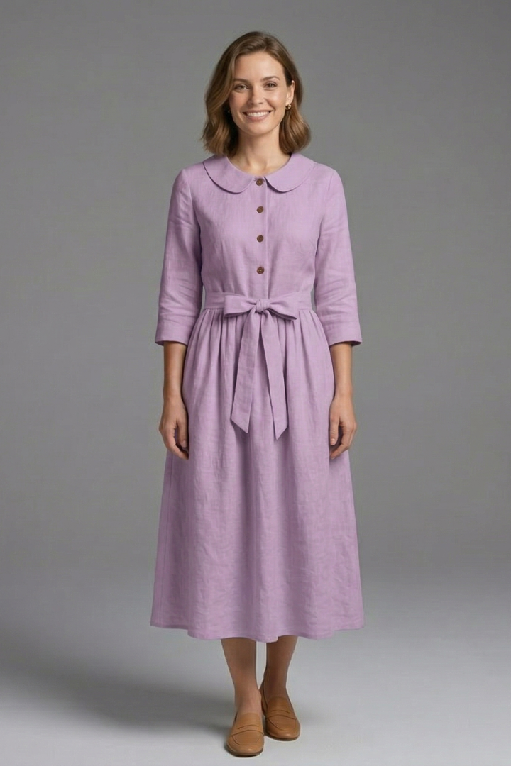 Women's V-neck midi dress, featuring a flattering waist tie. Elegant, versatile spring summer fashion.