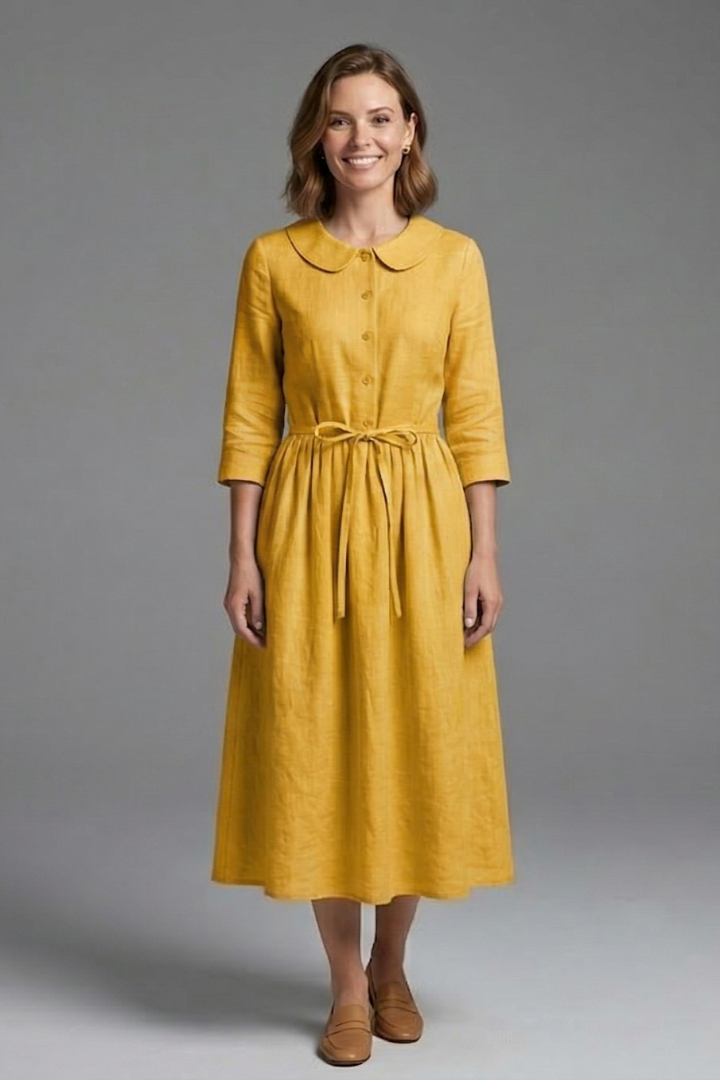 Close-up of the elegant waist tie on a women's V-neck midi dress, highlighting the versatile detail.