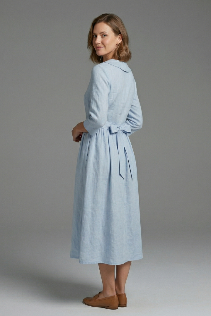Elegant women's fashion: V-neck midi dress with a waist tie, a flattering and versatile clothing choice.