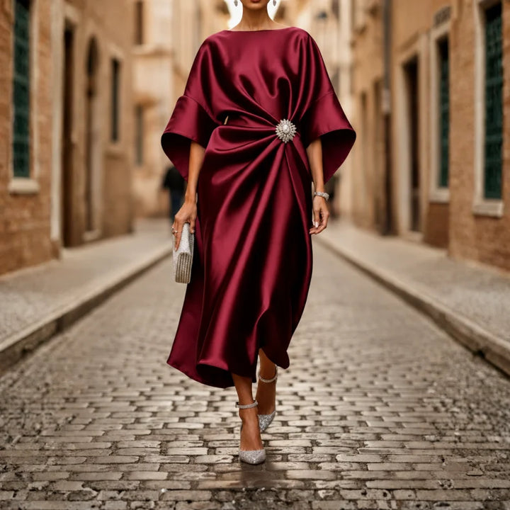Comfortable women's V-neck midi dress, elbow sleeves, and flowy flared skirt. Feminine & casual style.