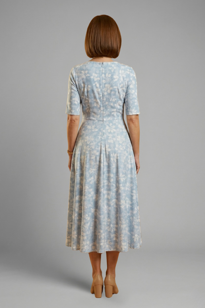 Relaxed fit women's V-neck midi dress with pockets and short sleeves. Comfortable for casual spring & summer fashion.