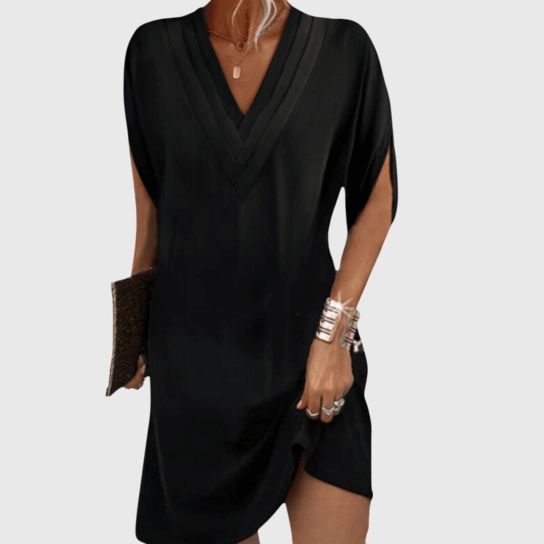 Women's V-neck mini dress, draped short sleeve, cocoon style for casual summer comfort.