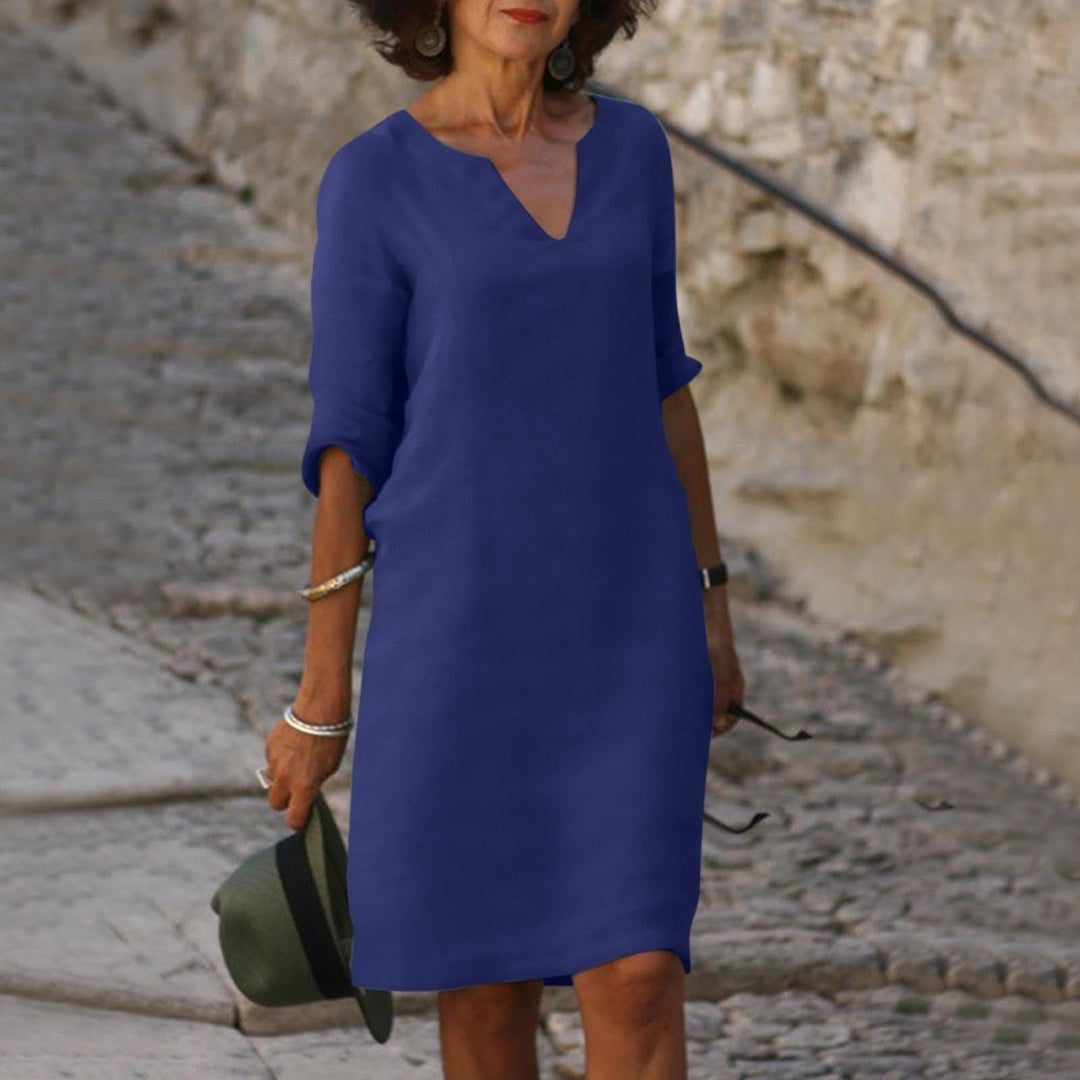 Versatile women's relaxed fit midi dress, a comfortable and stylish V-neck summer option.