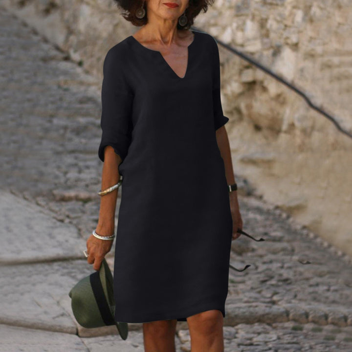 Stylish women's summer midi dress with a flattering V-neck and comfortable relaxed fit.