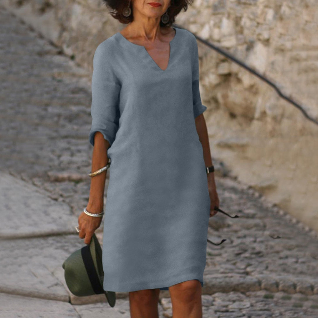 Elegant women's V-neck midi dress, versatile for spring and summer fashion.