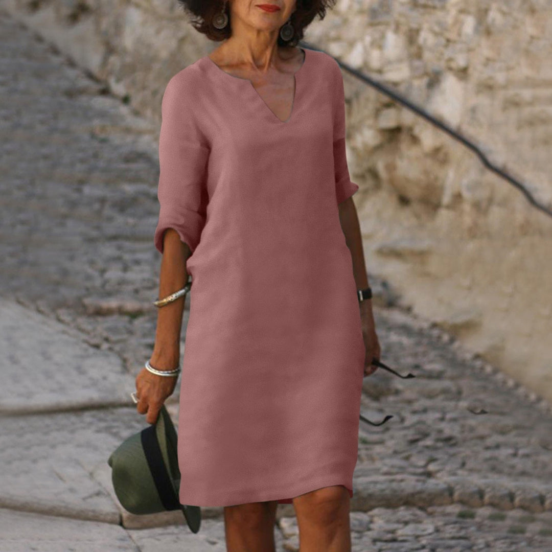 Relaxed fit women's midi dress, a comfortable and elegant choice for summer days.