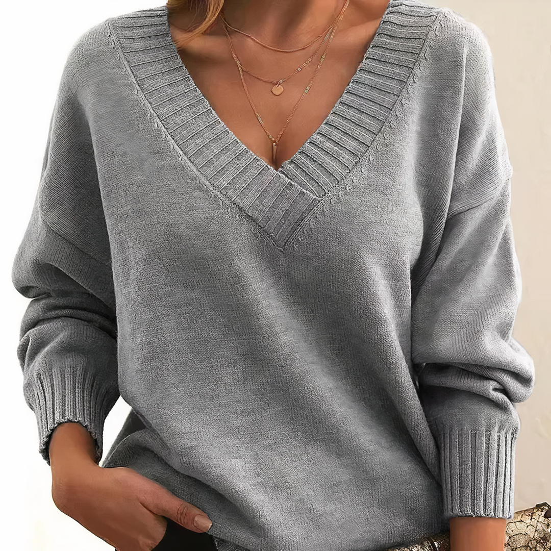 Fashionable women's ribbed v-neck sweater, a long sleeve top designed for comfort and everyday wear.