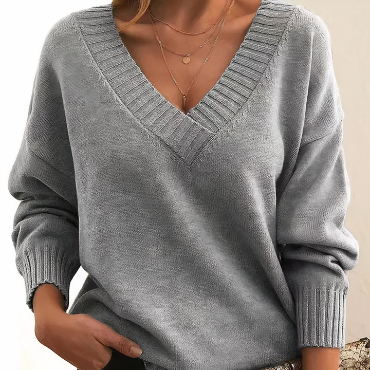 Fashionable women's ribbed v-neck sweater, a long sleeve top designed for comfort and everyday wear.