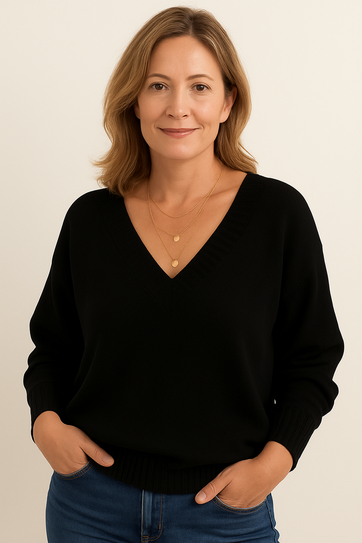 Elegant v-neck detail on a women's ribbed long sleeve sweater, ideal for casual fashion.
