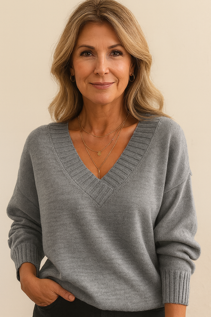 Cozy women's v-neck knit sweater with a relaxed fit and ribbed long sleeves for casual style.