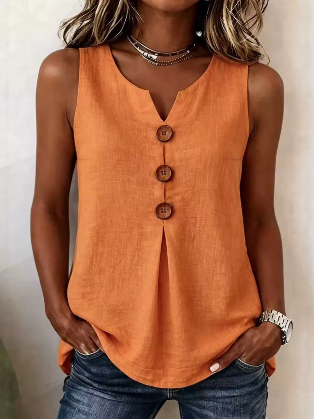 Effortless solid color V-neck sleeveless blouse with pleated front. A comfortable women's summer top.